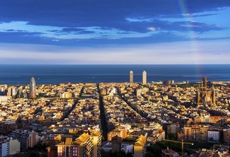 rainbow and barcelona skyline